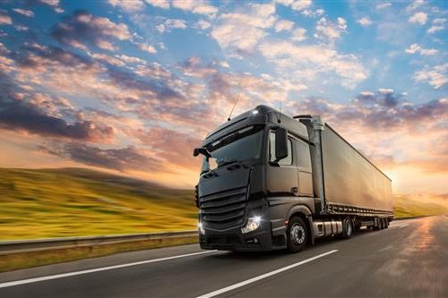 About Us Tay Business export trucks on the road delivering chemical products from Iran to international markets including Iraq, Afghanistan, Turkey, and Vietnam.